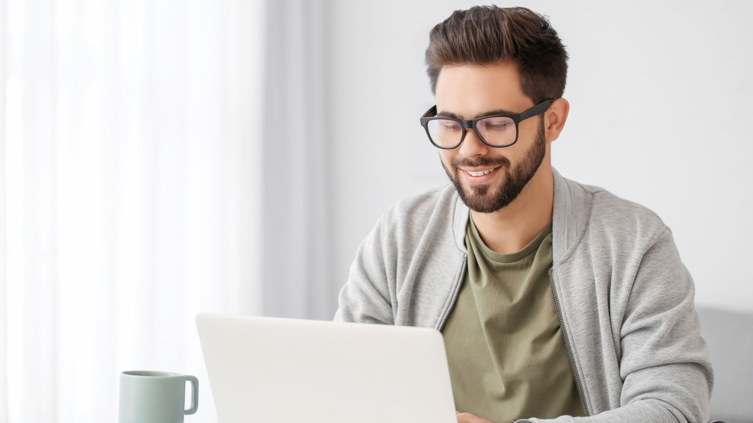 man in front of laptop